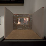 Peep-show 
(a 1:10 scale model of a set from Paris, Texas, 1984)
acrylic with one-way mirror film, balsa wood, tissue paper, foil, 
mesh, mat board, box board, glue, masonite, acrylic paint